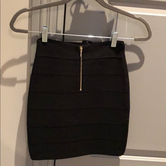 Black Bebe miniskirt with gold 1/4 zip in back - Picture 2 of 2